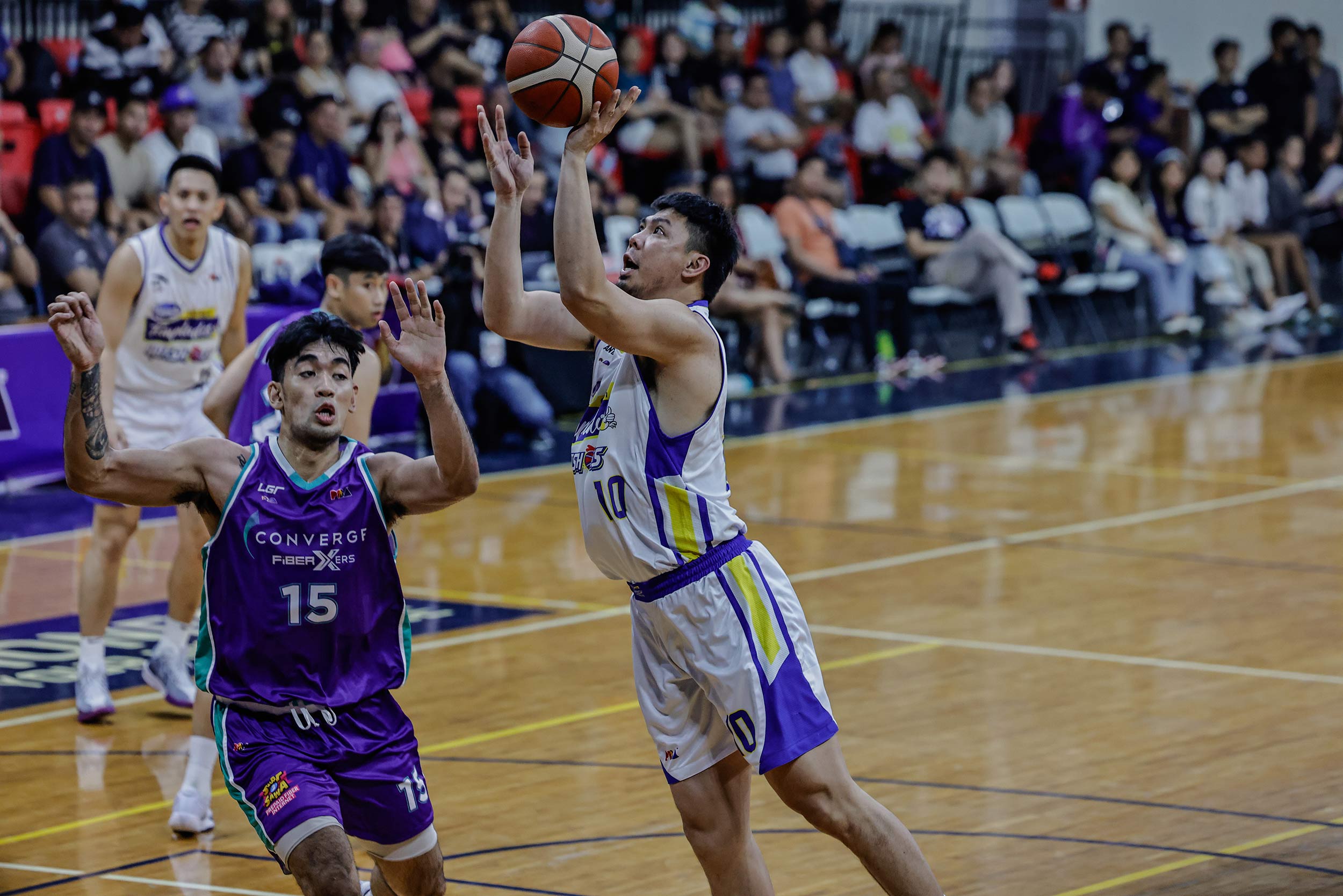 Ian Sangalang battles for a basket in Magnolia's game versus Converge