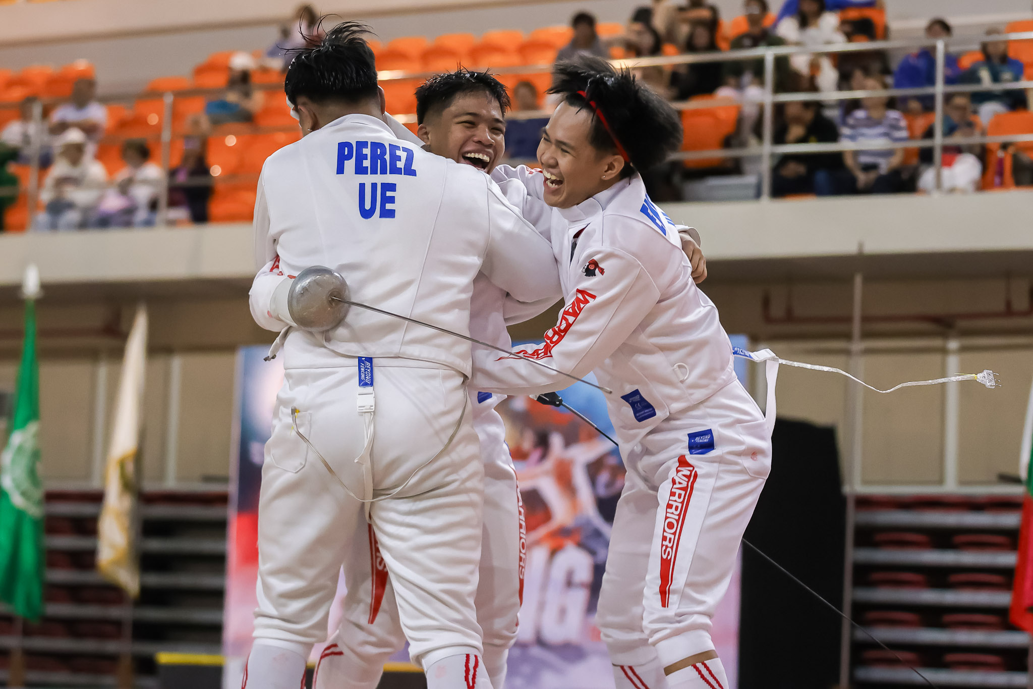 UE Men's Fencing team celebrates a win during the UAAP 86 Fencing tournament