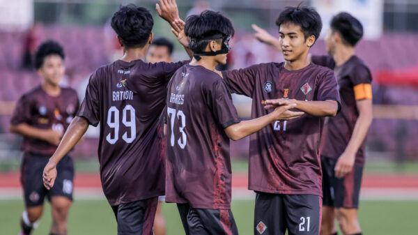 Garces celebrates with his teammates as UP routs UE in UAAP Men's Football