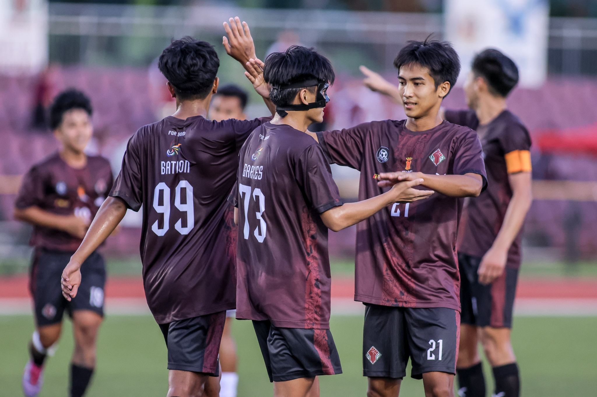 Garces celebrates with his teammates as UP routs UE in UAAP Men's Football