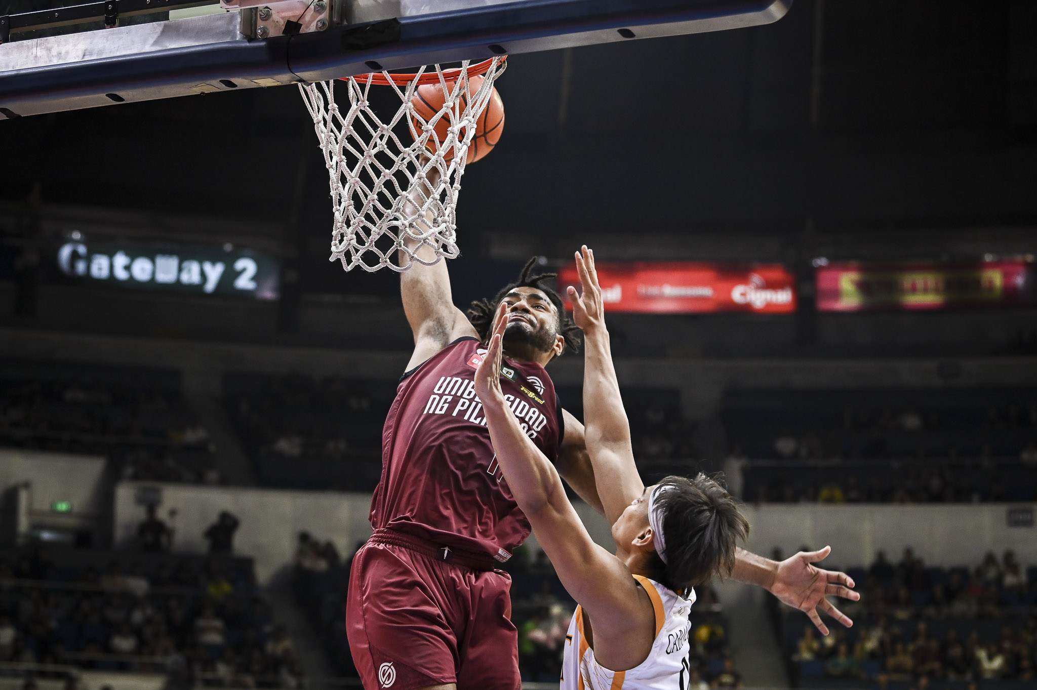 Francis Lopez brings the ball to the rim in UP's win over UST