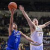 Ateneo's Jared Bahay goes for a shot against an NU player in UAAP Men's Basketball