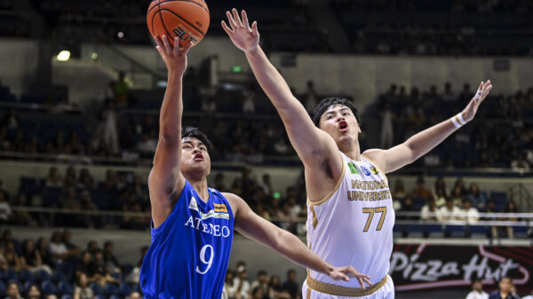 Ateneo's Jared Bahay goes for a shot against an NU player in UAAP Men's Basketball