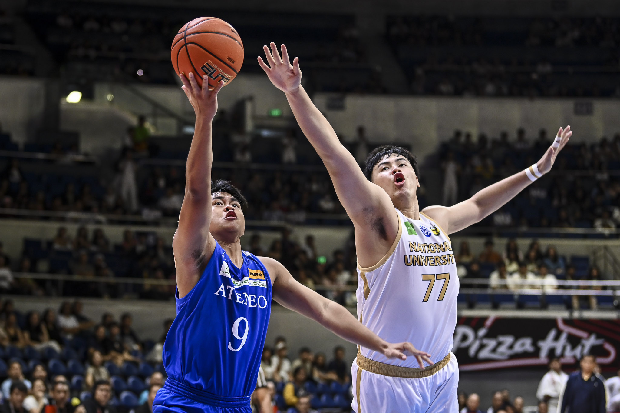 Ateneo's Jared Bahay goes for a shot against an NU player in UAAP Men's Basketball