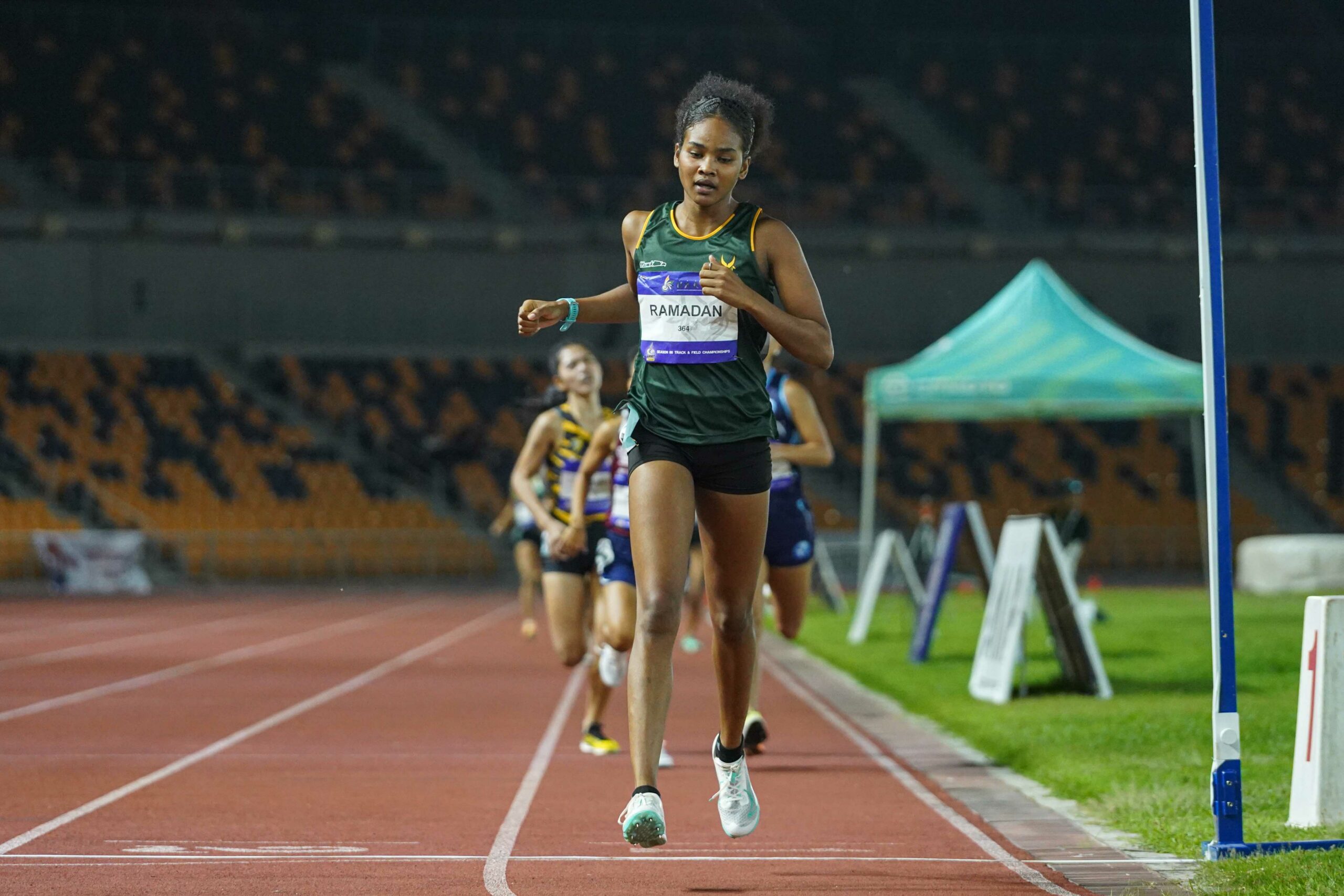 UAAP-Season-88-Athletics-800m-Womens-RAMADAN-09406-scaled Azeneth Serat smashes 16-year UAAP record, powers UST to early lead in Women's Athletics ADMU AdU DLSU FEU News NU Track & Field UAAP UE UP UST - philippine sports news